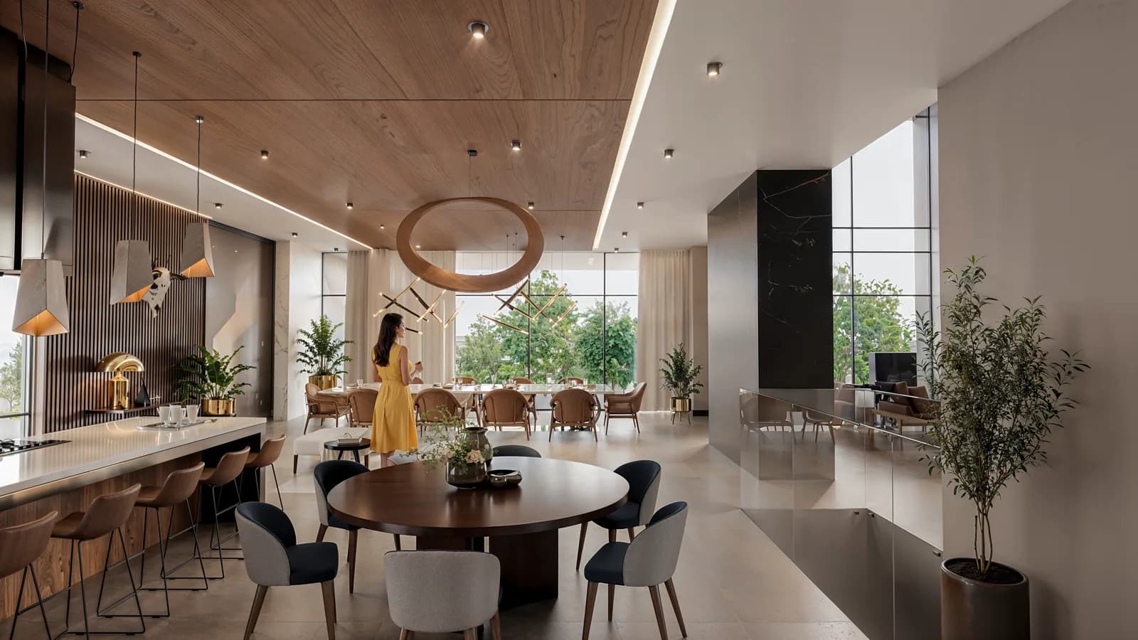 Render del comedor redondo y la barra bajo el plafón de madera, con ventanal al jardín.