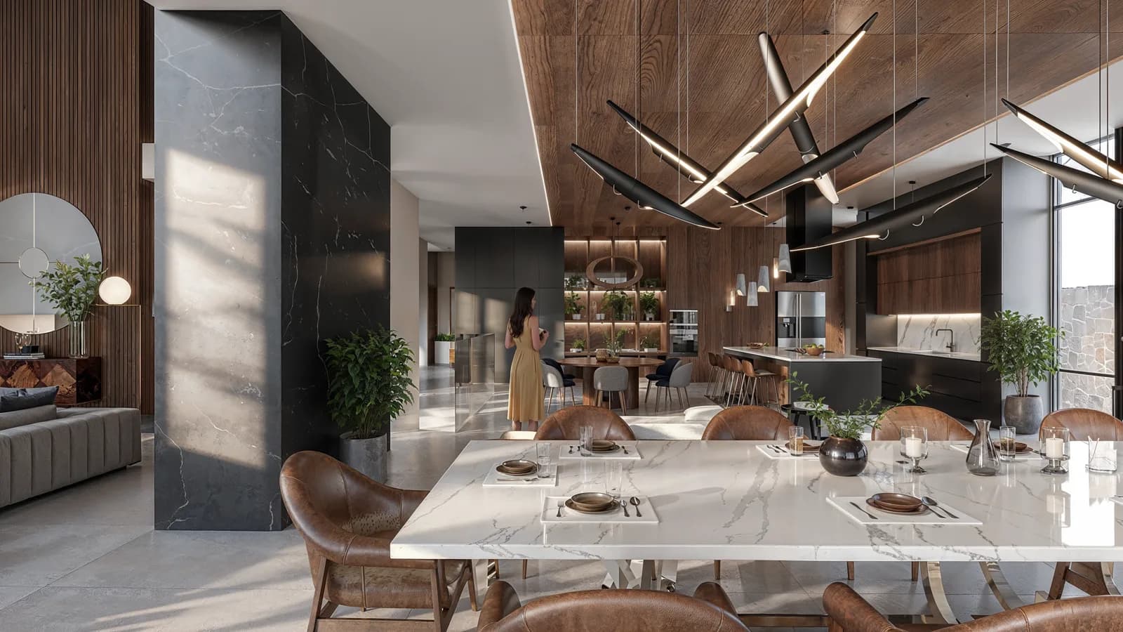 Otra vista del comedor con la columna de mármol negro y la cocina al fondo.